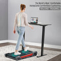 Model demonstrating benefits of Honey Comb Deck Cushioning on Egofit ComfortDeck-M2 gray treadmill