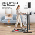 Gray compact treadmill stored under sofa – space saving and easy to move